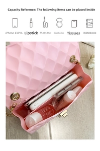 Internal view of pink quilted jelly bag showing capacity for phone and cosmetics
