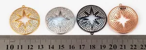 Detailed macro view of 32mm micro-pave star pendants in four metallic color finishes