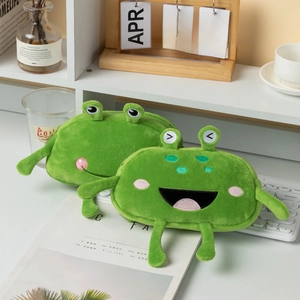 Detail of cute green frog plush pencil case showing soft texture and zippered opening