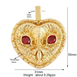 Golden heart-shaped owl pendant with red zircon eyes and detailed feather engraving