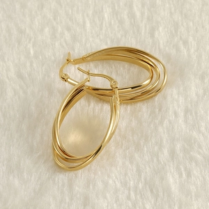 French vintage style 18k gold plated stainless steel twisted hoop earrings on white fur
