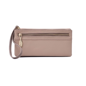 Close-up of pink litchi grain leather wallet with golden leaf zipper and hand strap