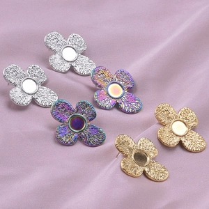 Three pairs of floral 304 stainless steel earrings in silver, gold, and rainbow finish