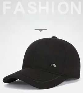 Detail view of winter baseball cap with ear protection and sport metal emblem
