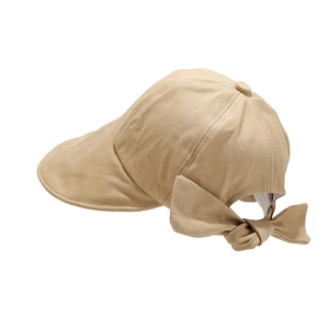 Women's khaki wide-brim sun hat with a large decorative bow on breathable canvas
