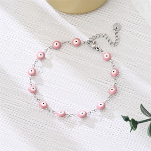 Pink evil eye charm bracelet with silver chain and adjustable lobster clasp closure