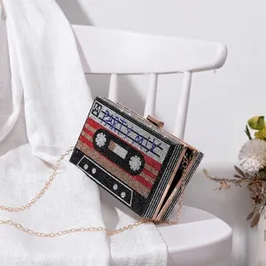 Vintage cassette tape evening bag with colorful rhinestones and party mix lettering