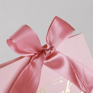Pink wedding candy gift box featuring a premium gold foil finish and elegant satin ribbon