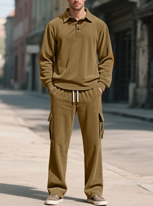 Detail of brown corduroy long sleeve polo top and cargo pants with textured fabric finish
