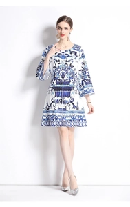 Detailed blue and white porcelain print on an A-line dress with chic flared sleeves