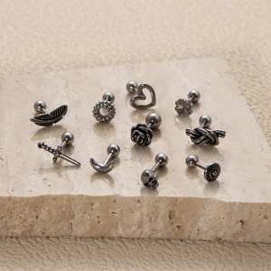 Vintage stainless steel ear studs collection featuring heart and clover shapes on stone