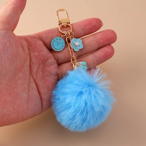Blue faux rabbit fur keychain with gold clock flower and shell charms for backpack