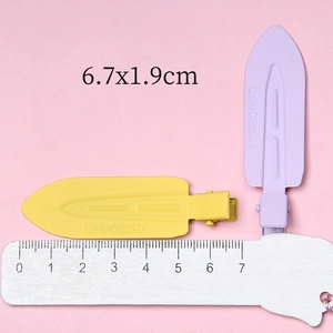 Matte finish yellow and purple non-marking metal hair clips with scale measurement
