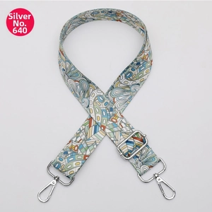 Close-up of colorful ethnic patterned bag strap with silver metal swivel hooks