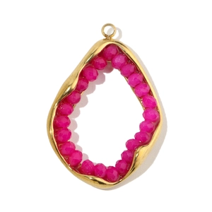 Detail of gold titanium steel pendant featuring faceted pink stone and oval frame