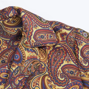 Close-up of paisley print shirt collar showing twill fabric texture and stitching quality