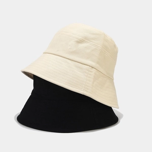 Detailed stitching on high-quality cotton fabric of minimalist beige and black bucket hats