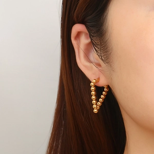 French style gold plated V-shaped triangle hoop earrings with metal bead design on model