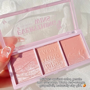 Detailed macro view of 3-color blush palette showing shimmer and matte powder textures