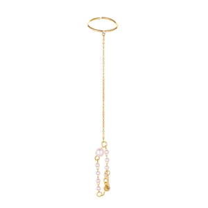 Golden hand harness with long chain connecting an open ring and elegant pearl pendant