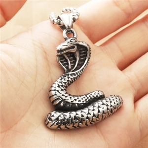 Handheld silver hip-hop cobra snake pendant with detailed scales and metal texture