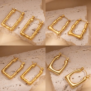 Golden titanium steel hoop earrings with bamboo, wave, and hammered textures for women