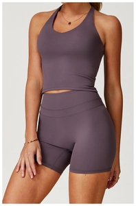 Close-up of mauve yoga set featuring racerback sports bra and high-waist shorts