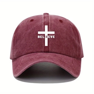 Vintage washed deep red baseball cap featuring a white cross and BELIEVE text