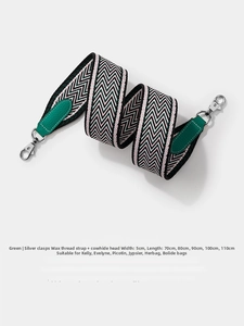 Close-up of 5cm wide green wave pattern woven bag strap with genuine leather and silver clip