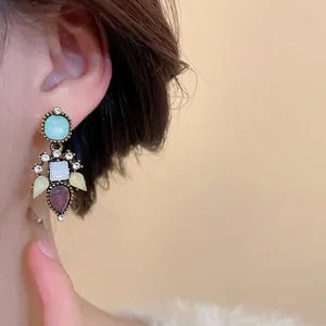Bohemian vintage heart earrings set with multi-colored crystals and golden metal finish