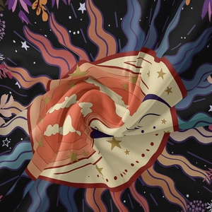 Detailed view of bohemian tapestry fabric with sun and moon print and soft texture