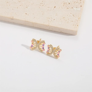 Boucles d'oreilles papillon rétro dorées avec émail rose violet et strass étincelants