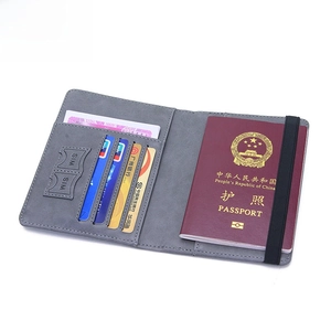 Slim grey RFID blocking passport wallet with internal card slots and elastic strap closure