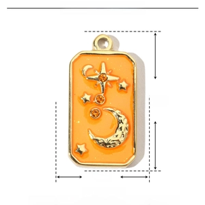 Detailed view of gold rectangle pendant with orange enamel star moon and dimensions