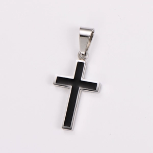 Detailed view of a silver stainless steel cross pendant with black inlay inlay on white background