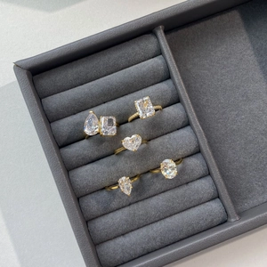 S925 sterling silver rings with assorted zircon shapes on a velvet jewelry display tray