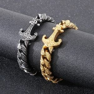 Detail view of gold and silver steel bracelets with Celtic knot and anchor motifs