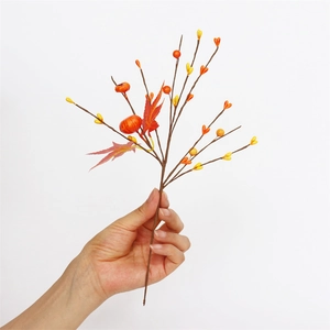Artificial fall stems with mini pumpkins, red maple leaves and berries on white background