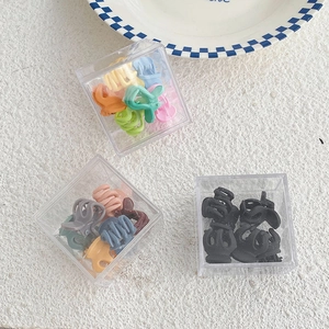 Lot de trois boîtes de mini pinces à cheveux colorées en plastique pour filles