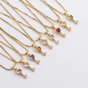 Detailed display of colorful heart key necklaces with crystal accents and golden box chain