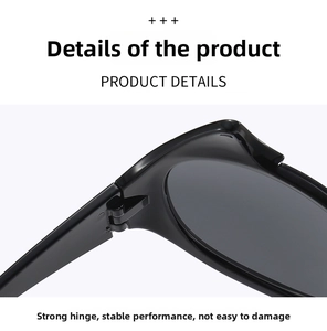 Close-up of the sturdy metal hinge and temple joints of stylish black devil sunglasses