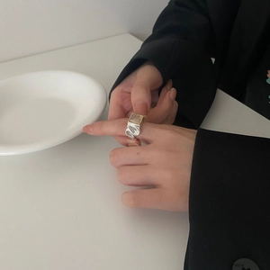 Irregular textured S925 sterling silver ring with rectangular natural stone on model hand