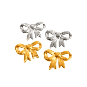 Polished 18K gold and silver stainless steel bow knot stud earrings on white background