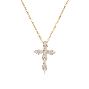 Elegant gold cross pendant necklace featuring pear and round cut white sparkling crystals