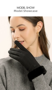 Detail of warm black velvet gloves for women with faux fur trim and fashion label