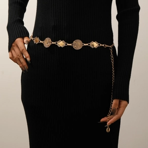 Detailed view of bohemian gold waist chain with textured circular and diamond metal plates