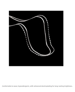 Close-up of double-layer bead and twisted rope silver chain with polished finish