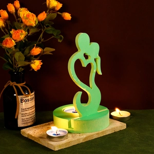 Romantic light green heart-shaped candle holder with embracing couple art and tea light slots