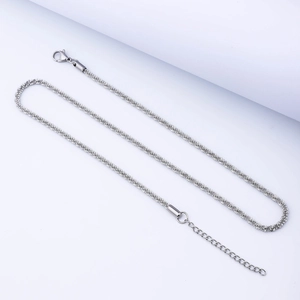 Detailed view of silver stainless steel twisted rope chain with lobster clasp and extender