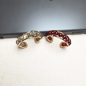 Detail of 14K gold filled wire wrapped earrings with garnet and labradorite beads